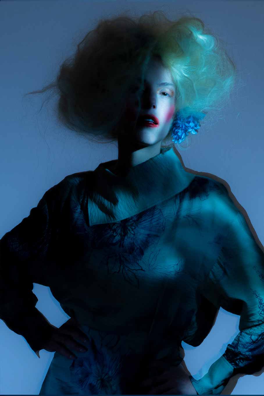 Medium shot of a model captured with long exposure and shifting light, blending sharp form with blurred movement in a surreal effect.